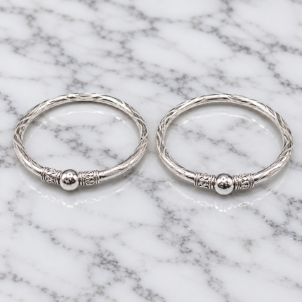 Elegant Pure Silver Kids Leg Kada Pair with stylish twisted detailing and traditional design, perfect for festivals, special occasions, and gifting.Pure Silver Kids Leg Kada Pair | Designer Silver Payal for Kids